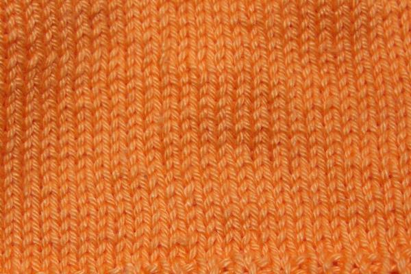 Hand knitted baby cap in orange with a head circumference 43 cm 16,93 inch